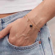 The mini charm bracelet worn