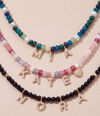 Beaded name necklaces spelling MIA, KATE and NORA