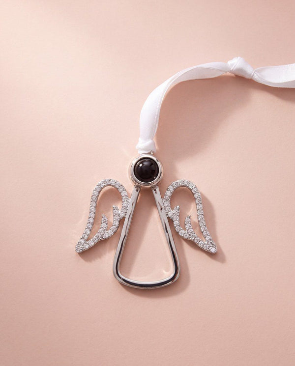 Crystal angel photo ornament on a blush background
